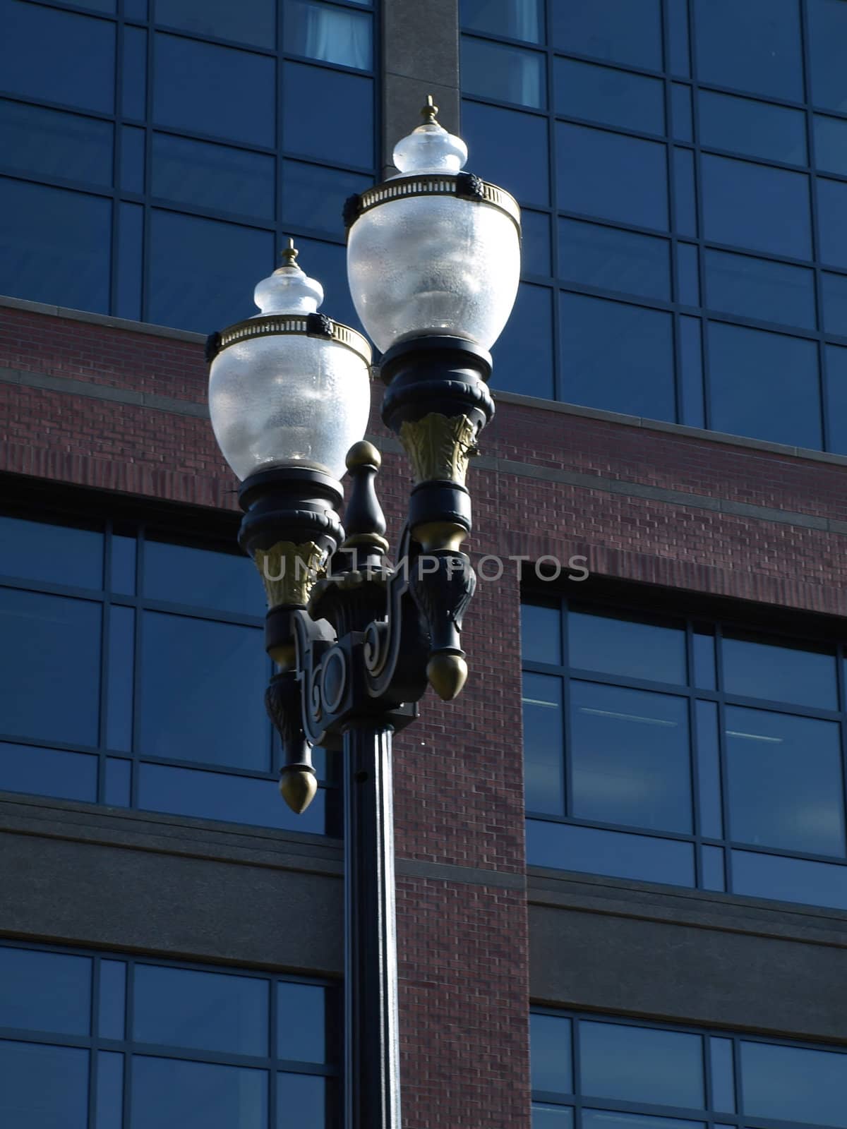 Electric Lamp post outside of a modern styled building.