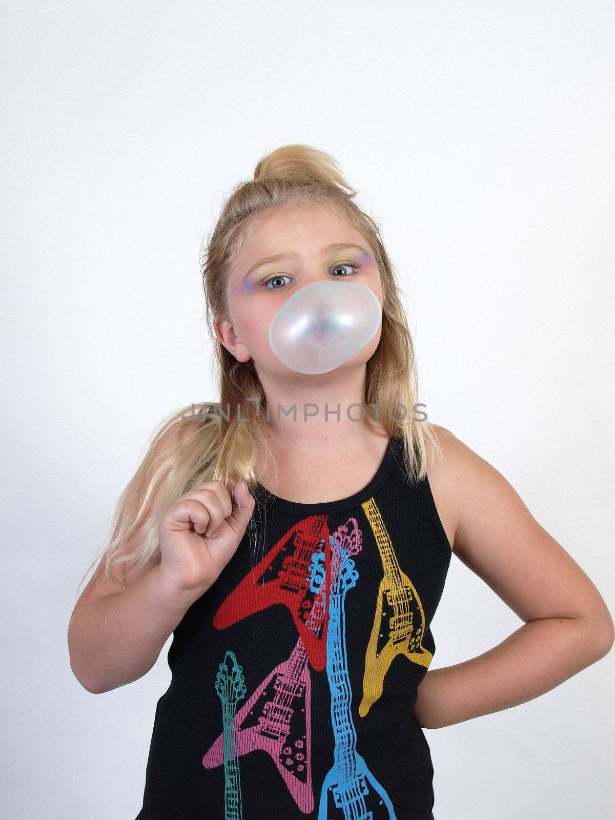 A girl blowing a bubble with her gum. Over white.