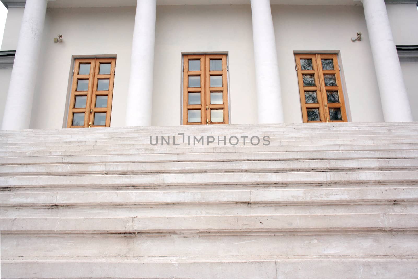 Marble stairs leading to three doors