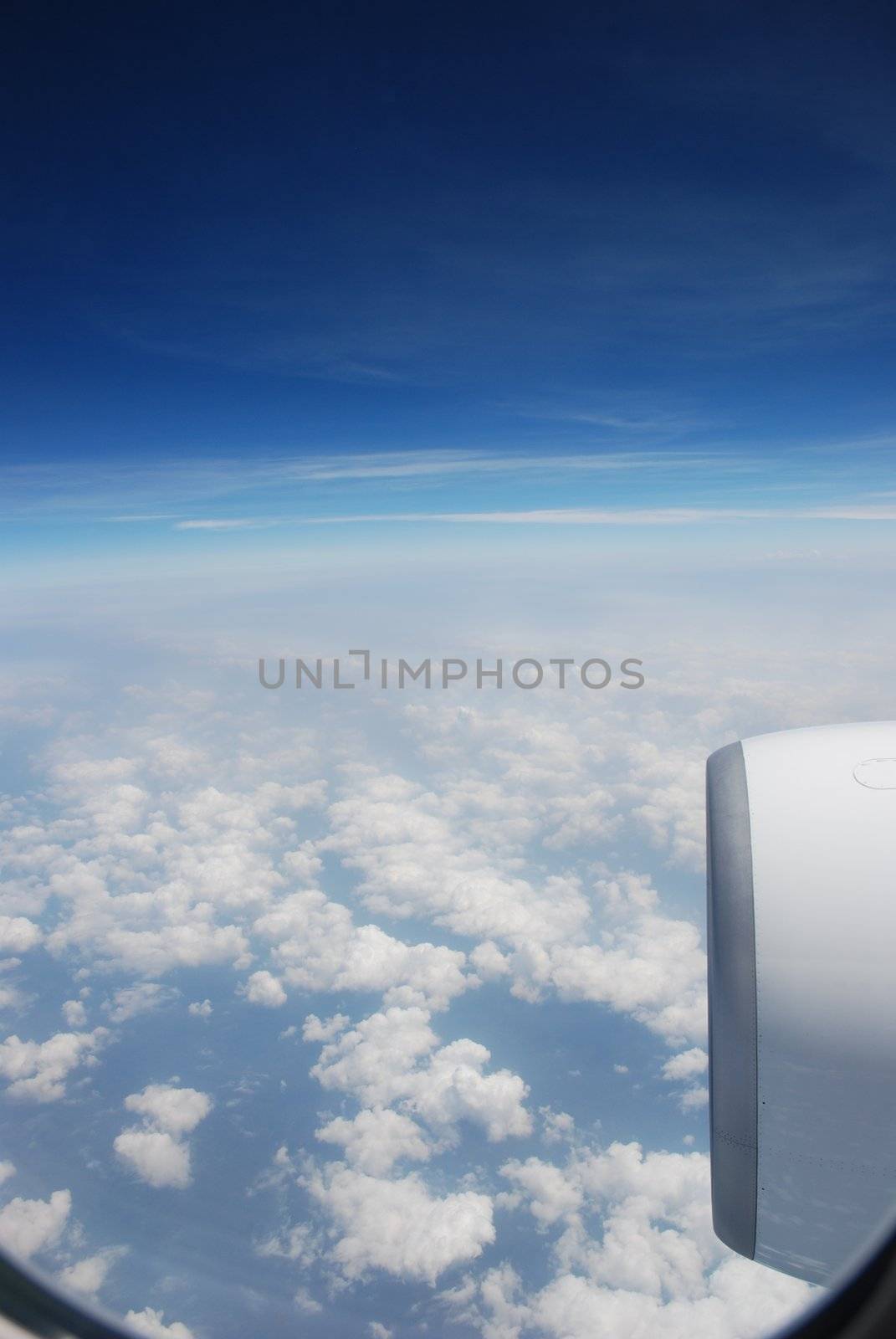 Sky through the airplane window by Firelia