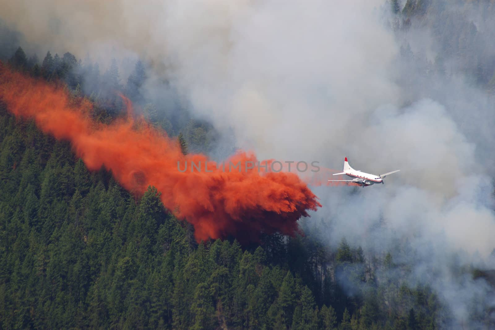 Forest fire fighting in the mountains using an airplane