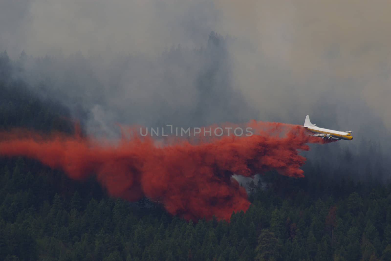 Forest fire fighting in the mountains using an airplane