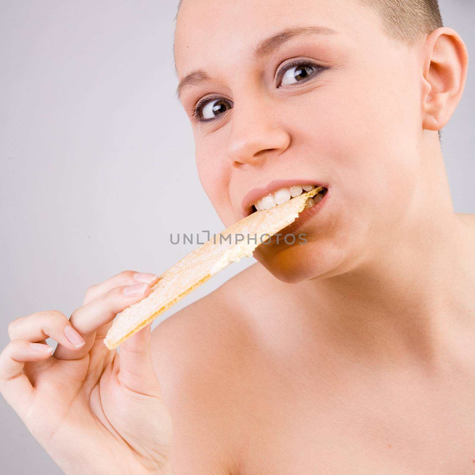 Young goodlooking woman with a ice cream on her head