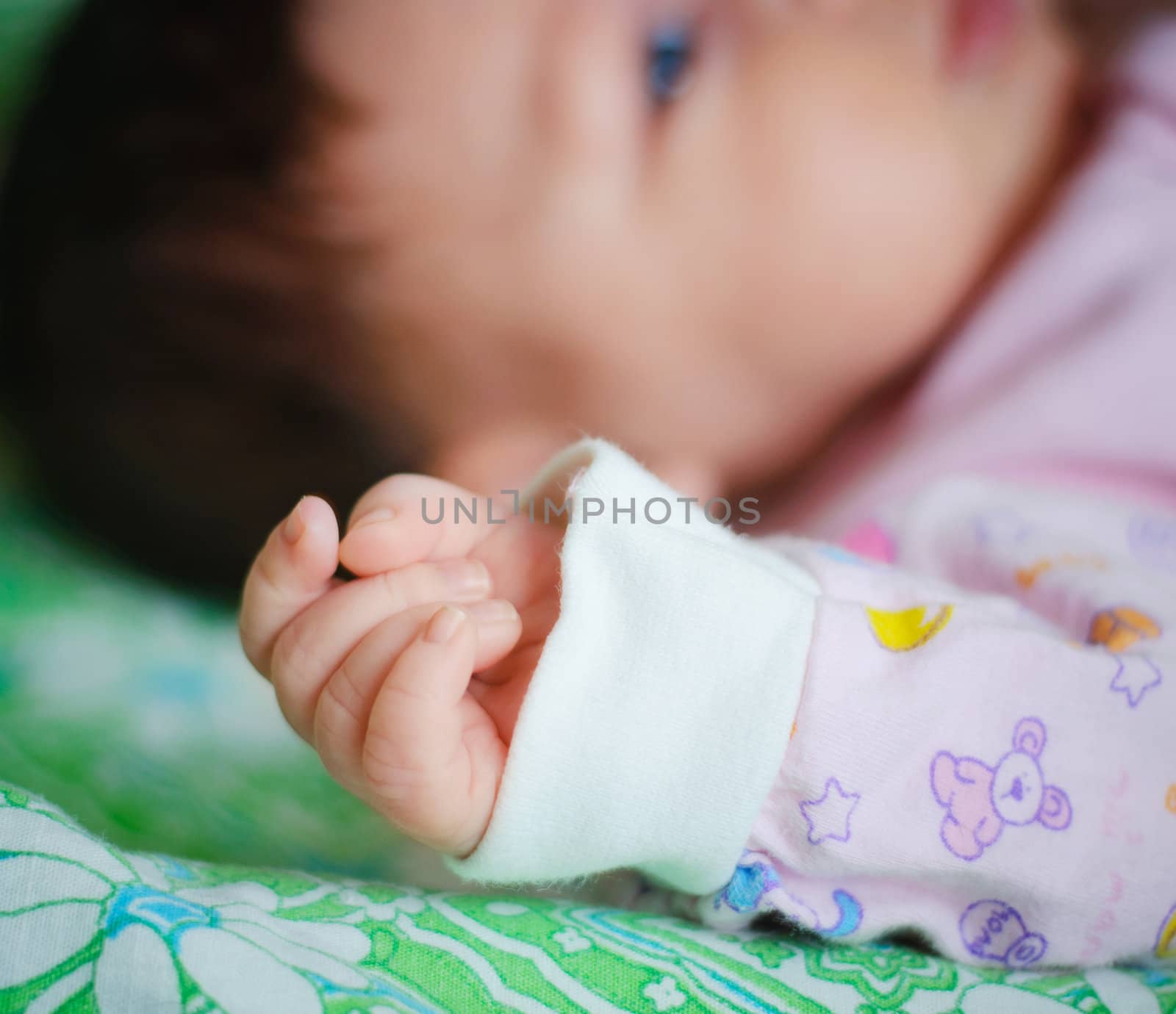 sleeping newborn baby focus on the hand