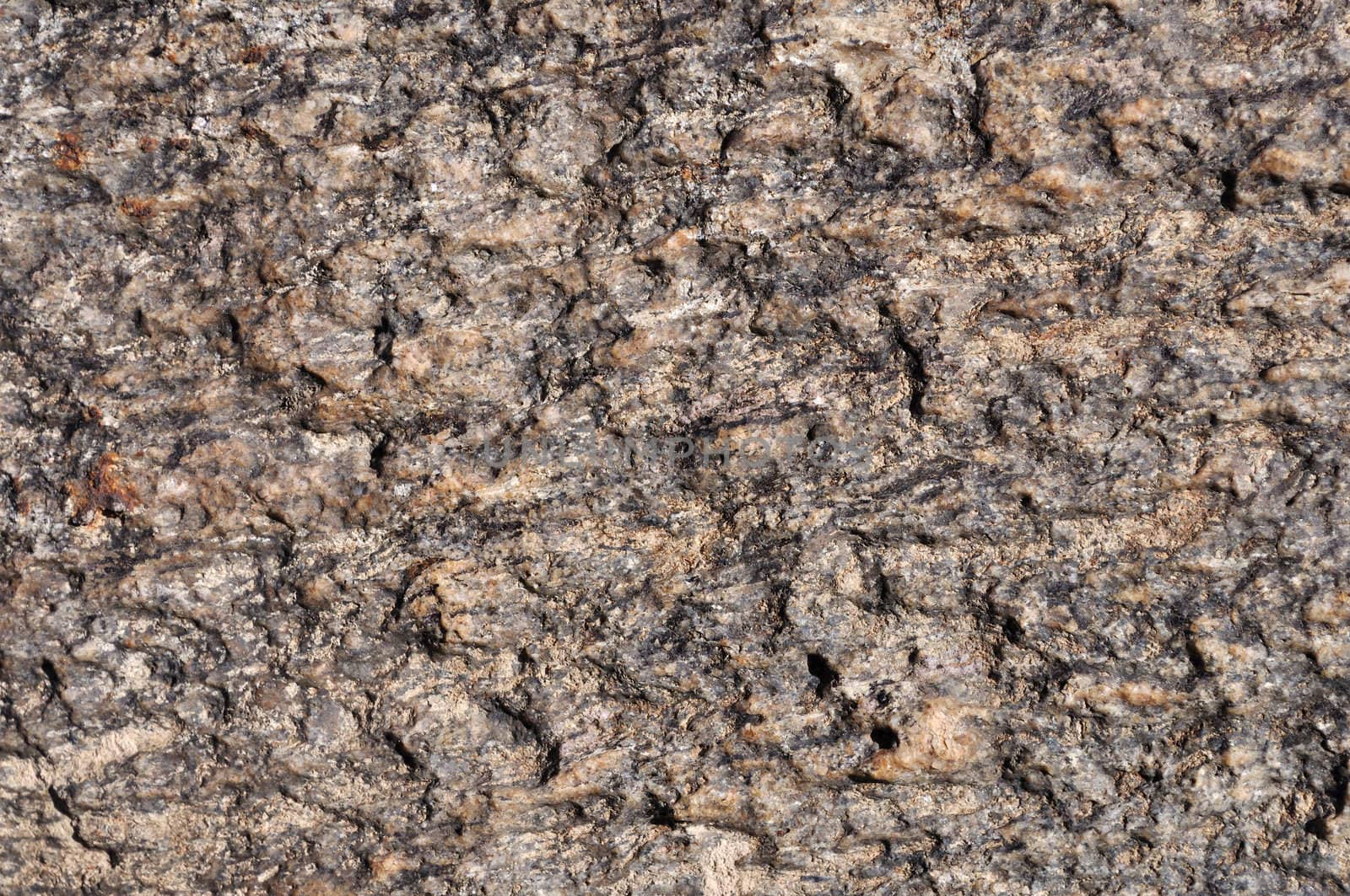 Fragment of natural brown stone surface texture