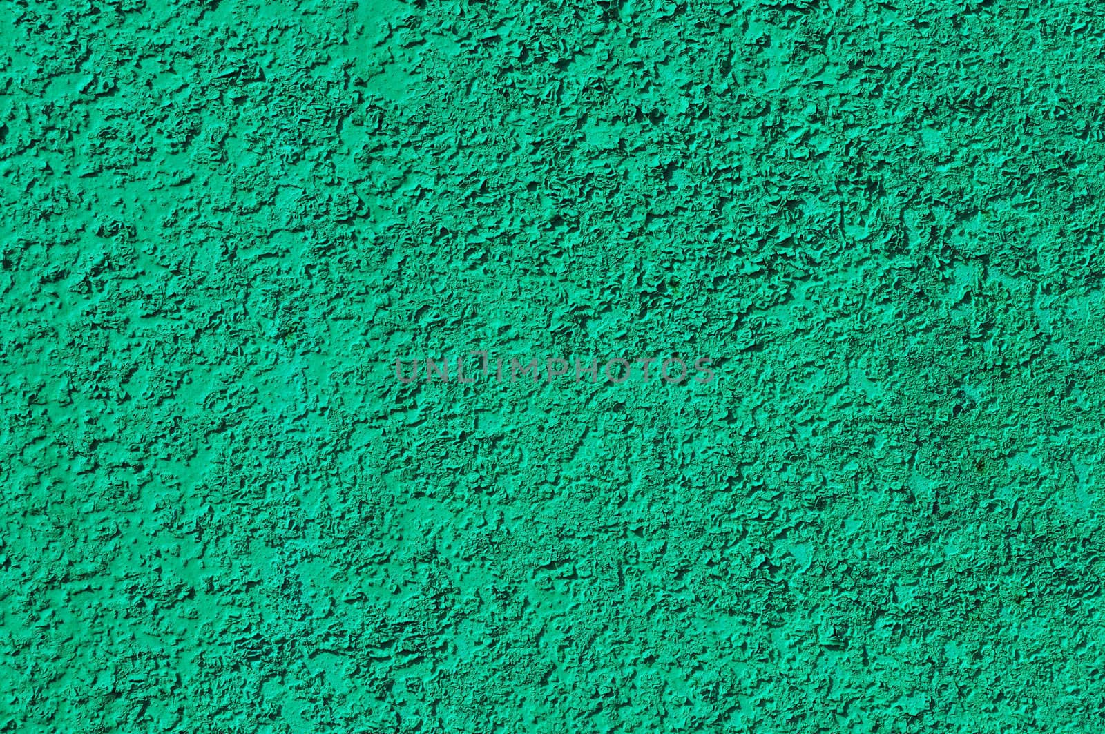Fragment of rough green colored metal surface