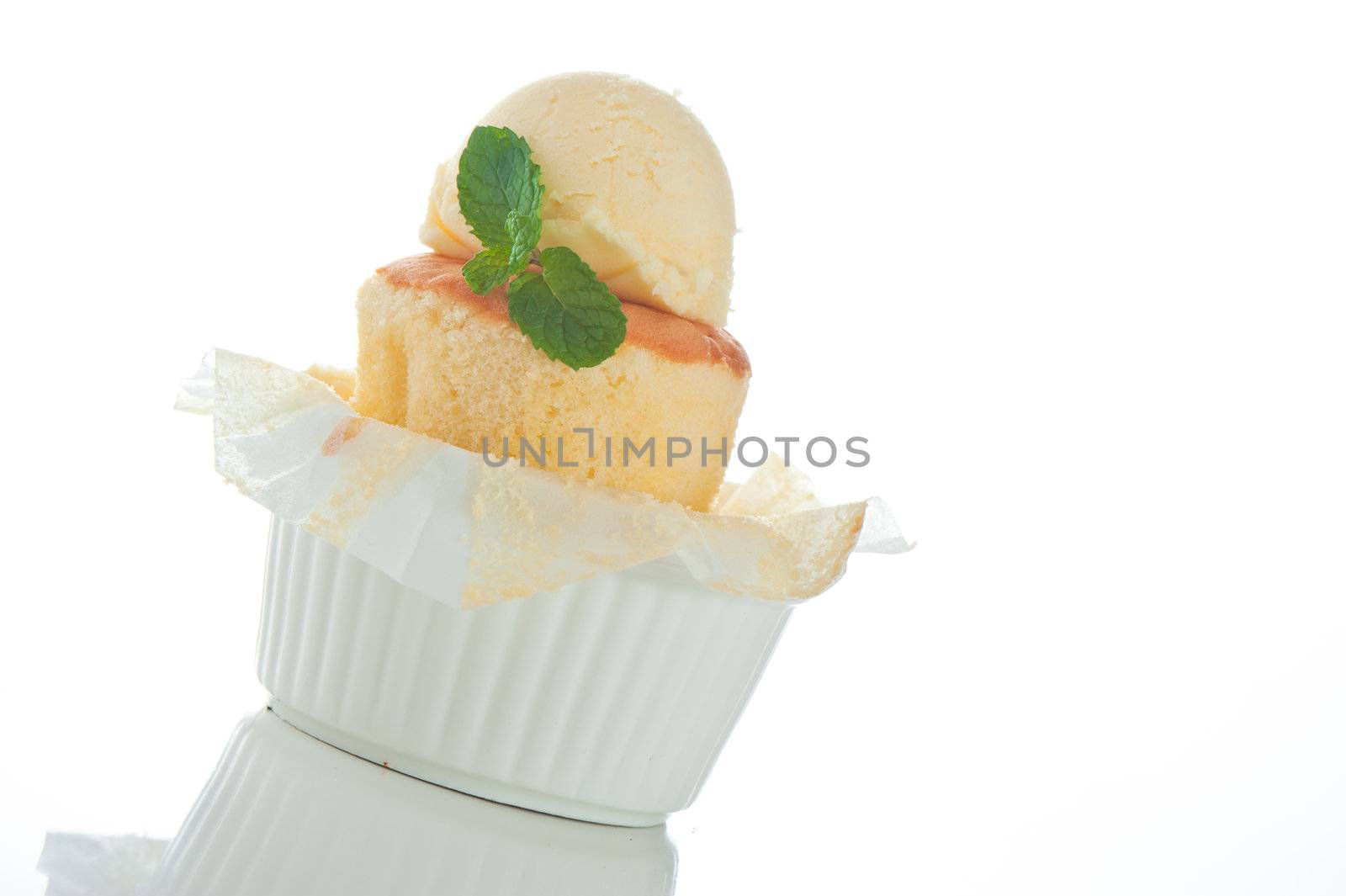 Cake with ice cream and mint leaf in a rameki