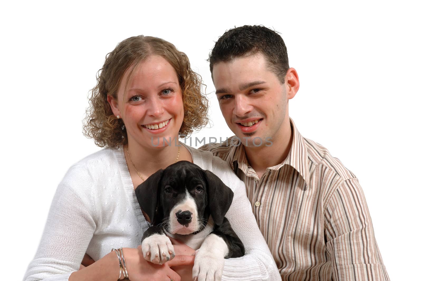 Young couple are sitting with their sweet dog