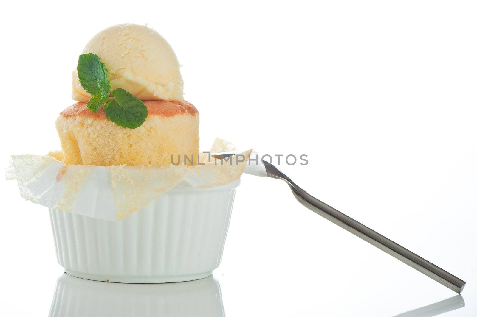 Cake with ice cream and mint leaf in a rameki