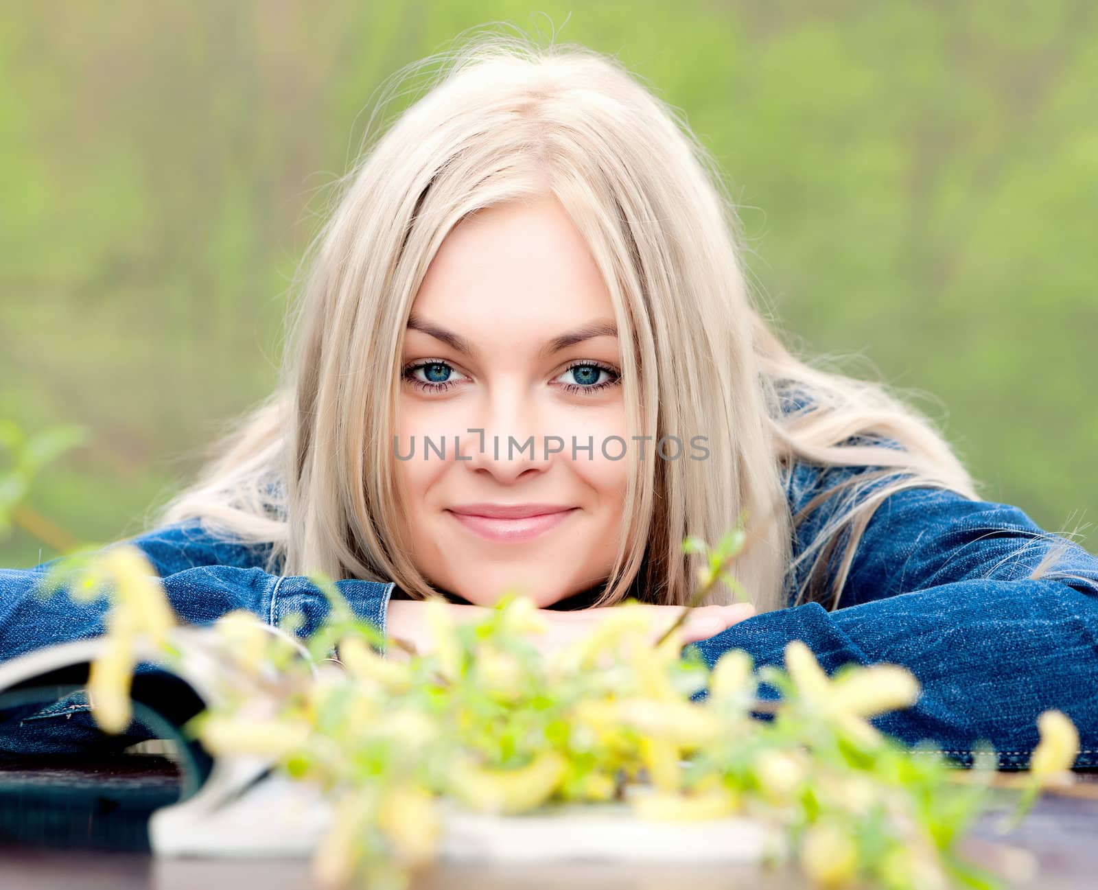 The young blue-eyed blonde in the spring afternoon.