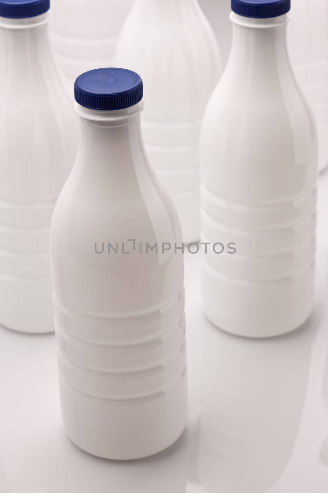 food series: white plastic milk bottle over white