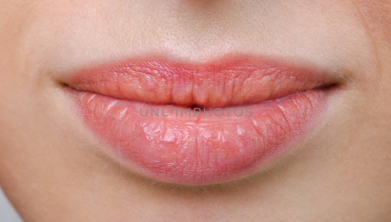 female sensual lips closeup without makeup