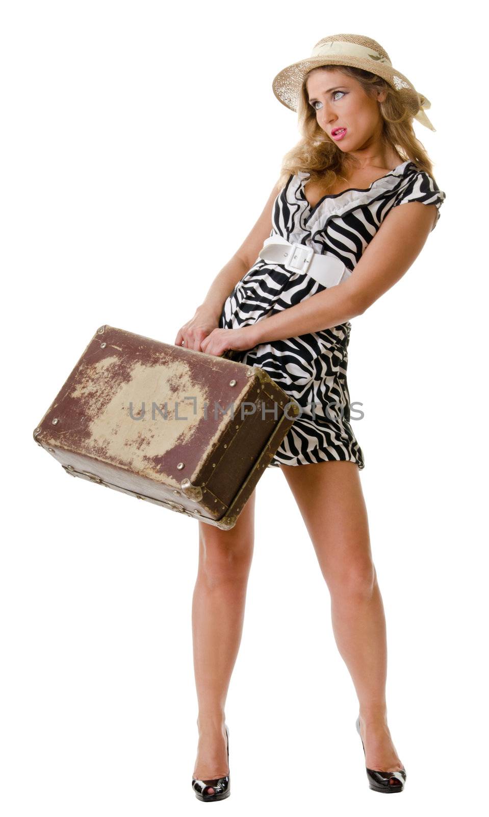 young woman dressed in retro style with an old suitcase