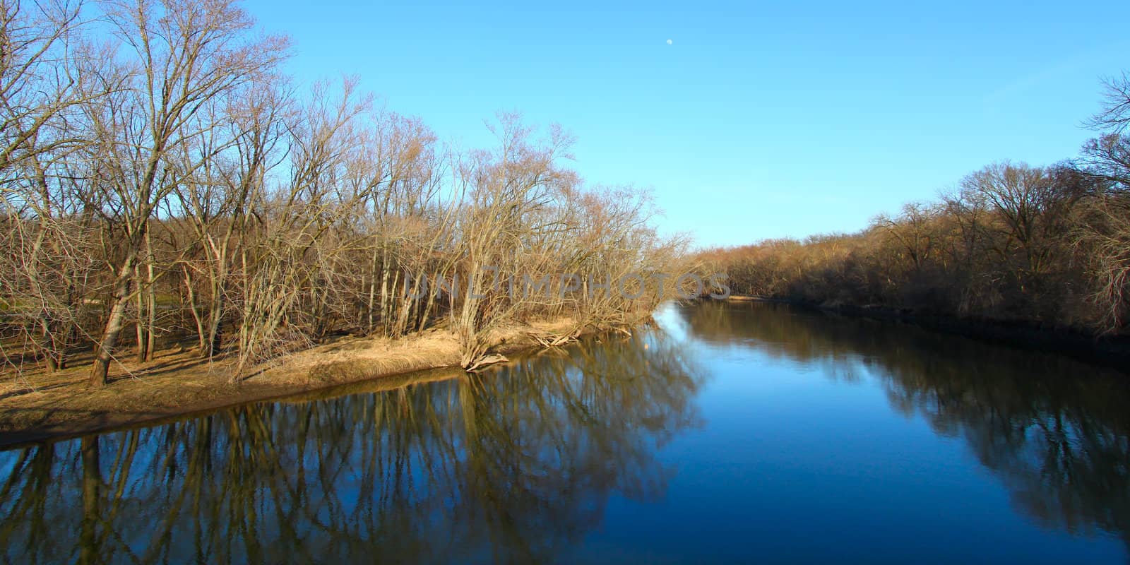 Trees reflect off the Kishwaukee river in northern Illinois.