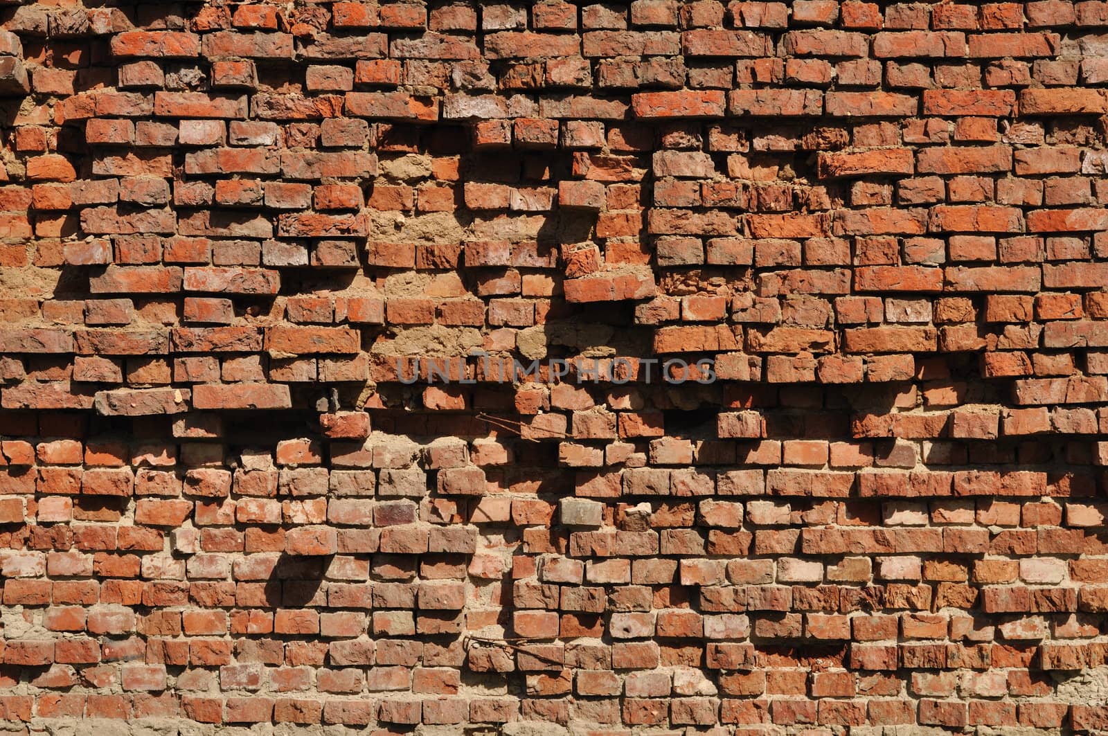Fragment of old destroyed brick wall background