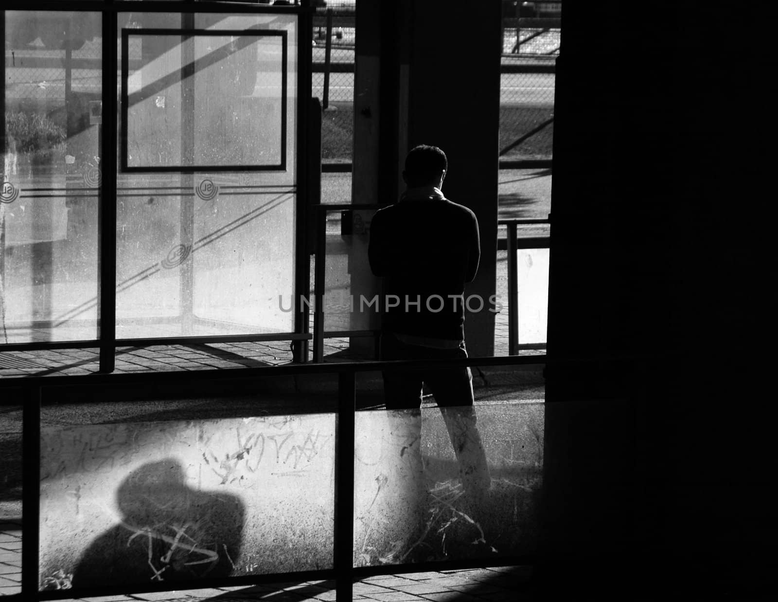 Man waiting for the bus an early morning at Slussen in Stockholm.