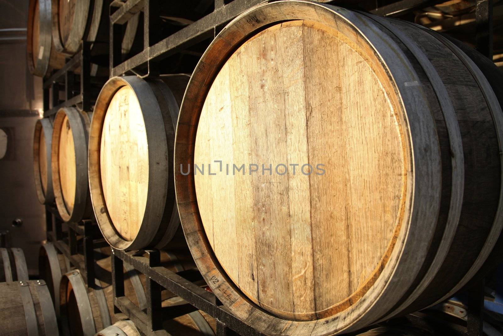wooden wine barrels in a wine cellar