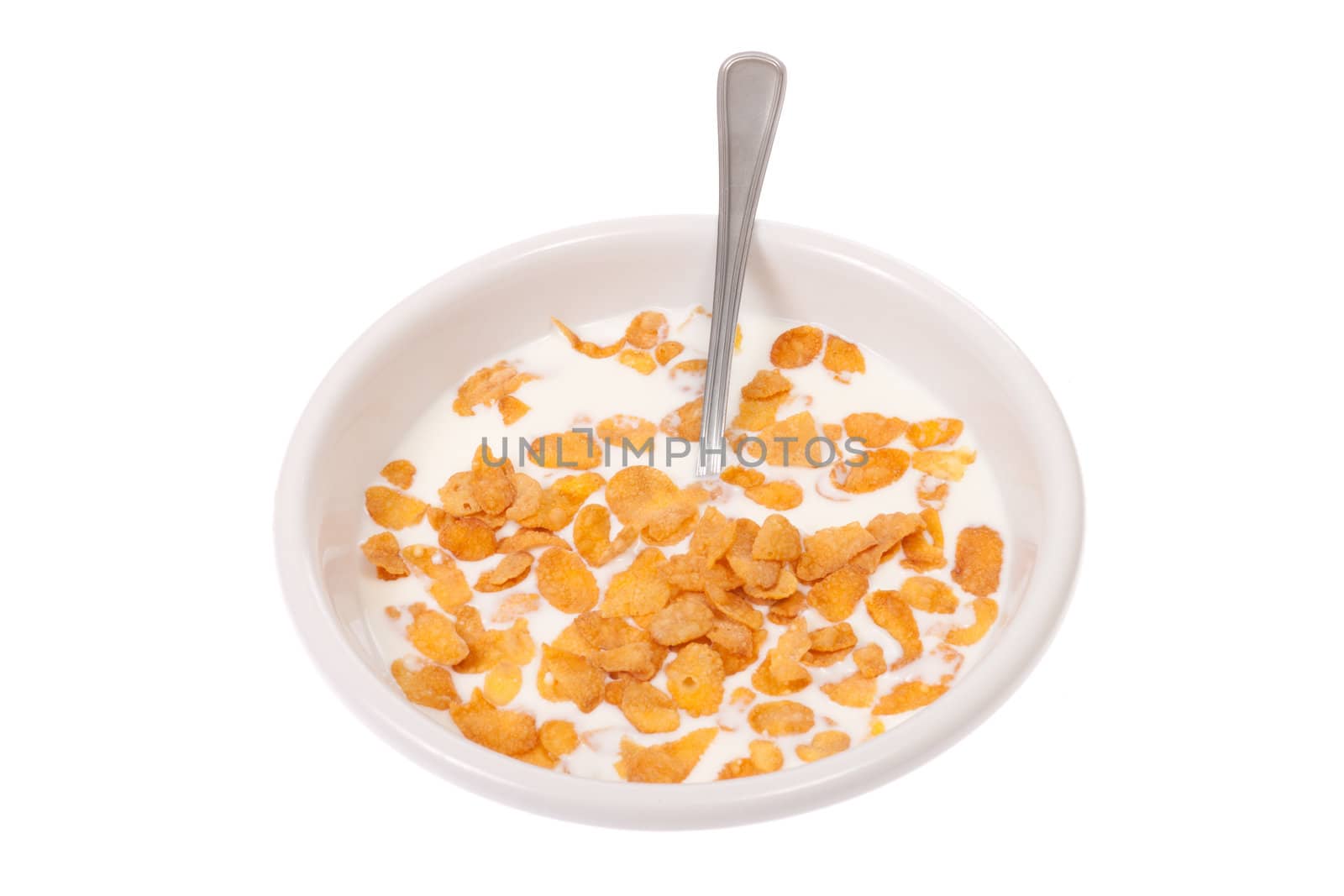 Bowl with corn flakes and milk, photo on white 