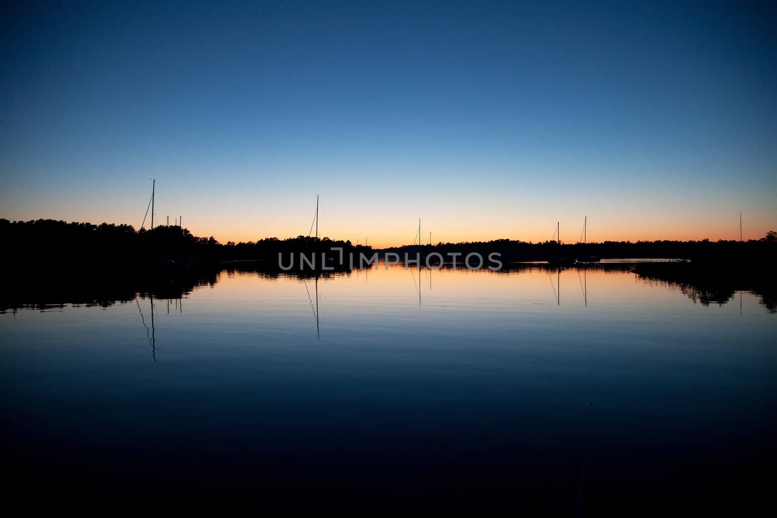 Sailboats silhouette in sunset
