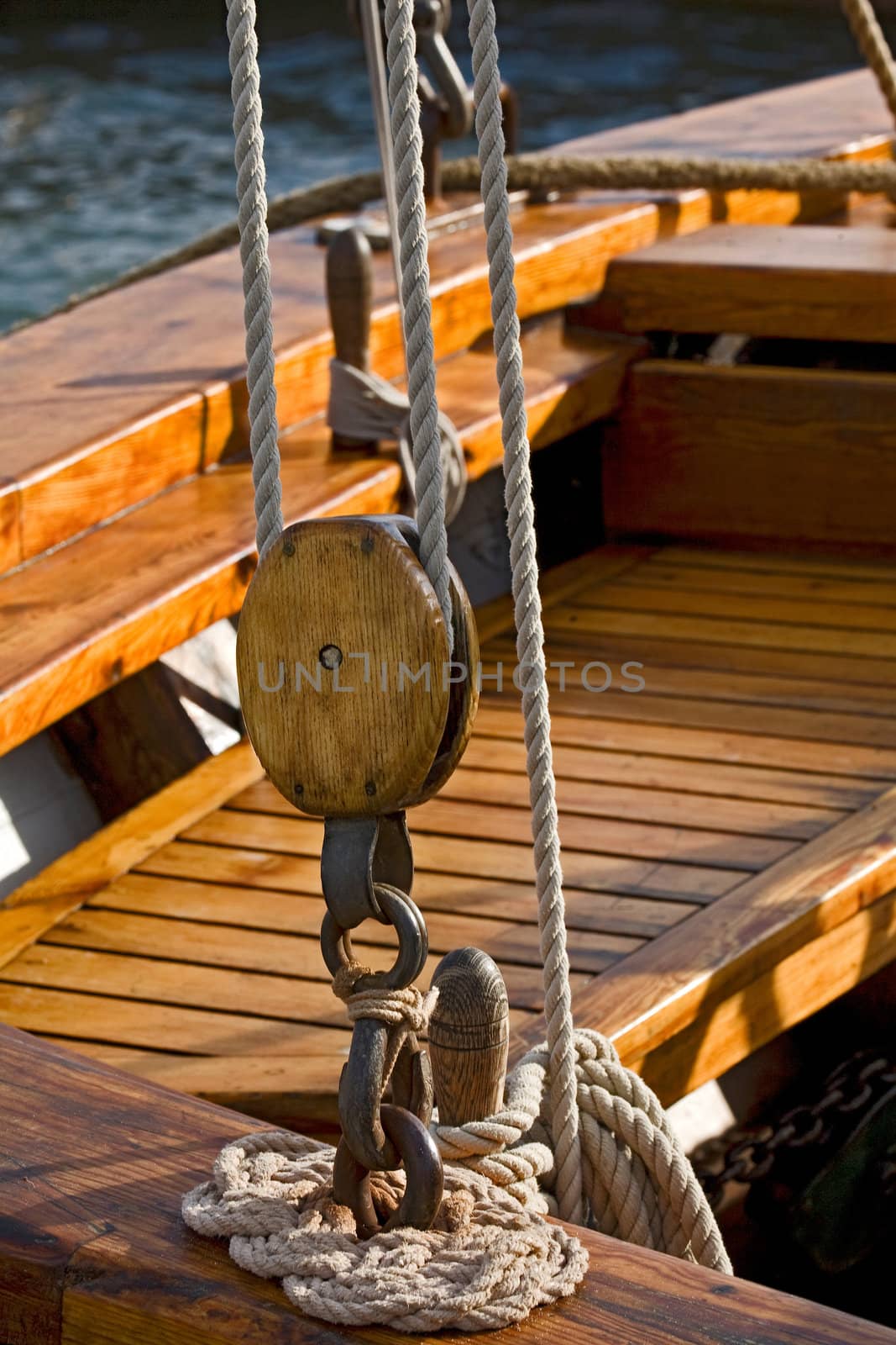 Old wooden block with rope. 