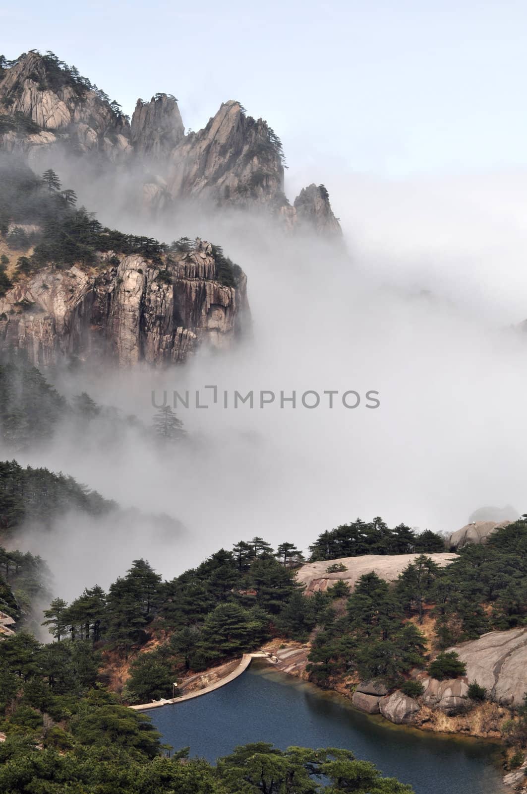 Landscape of mountains in the morning fogs