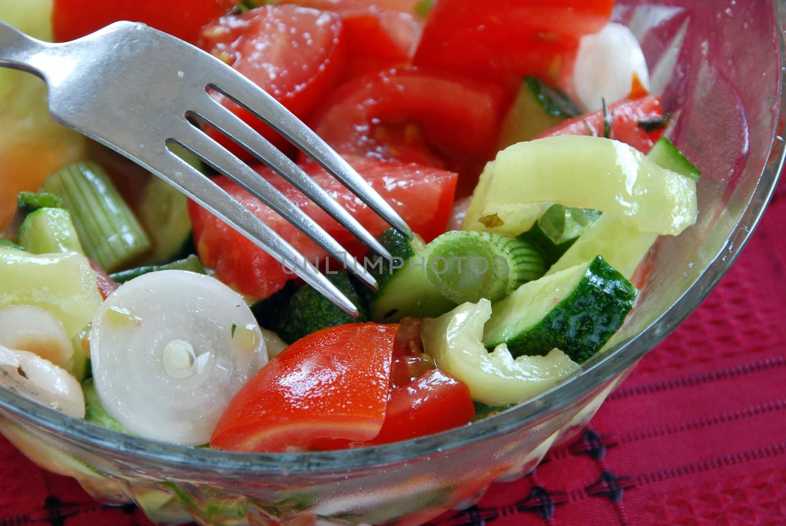 fresh appetizing vegetable salad with tomatoes and cucumbers closeup