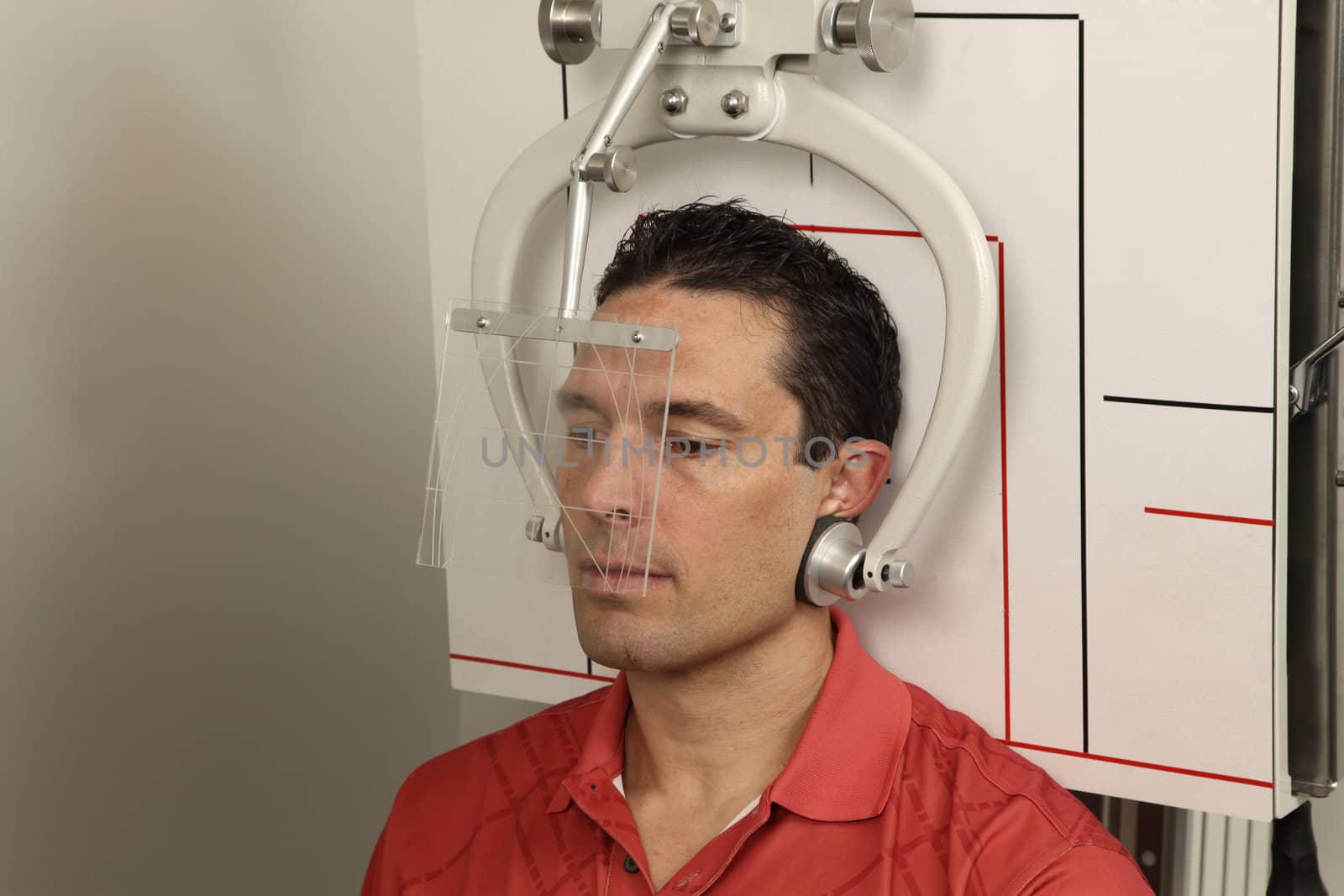 A patient getting his head x-rayed