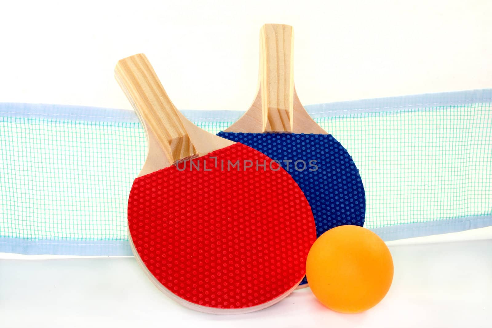 two table tennis bats, net and ball on a white background