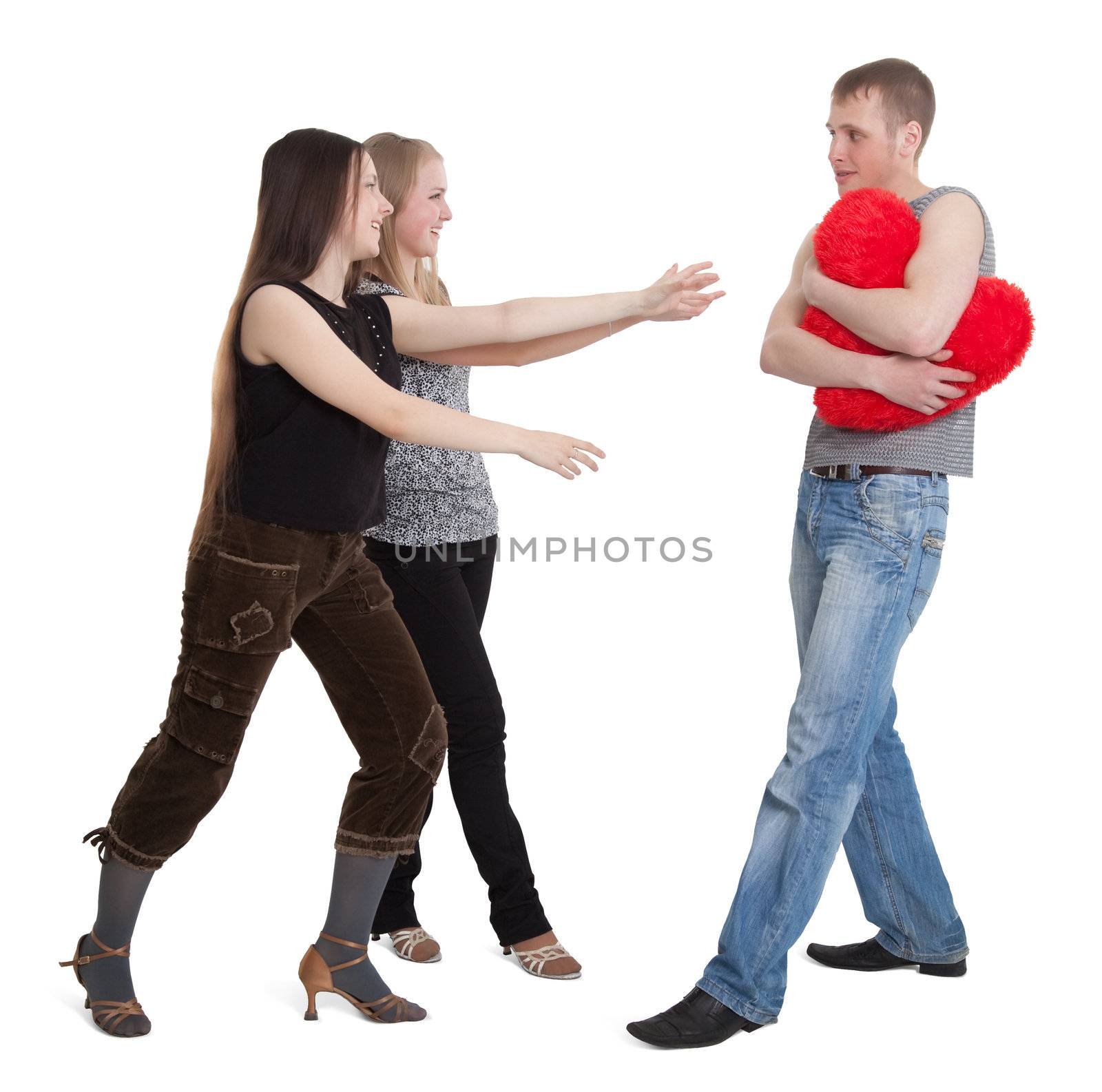 Two girls share a young man isolated on white background