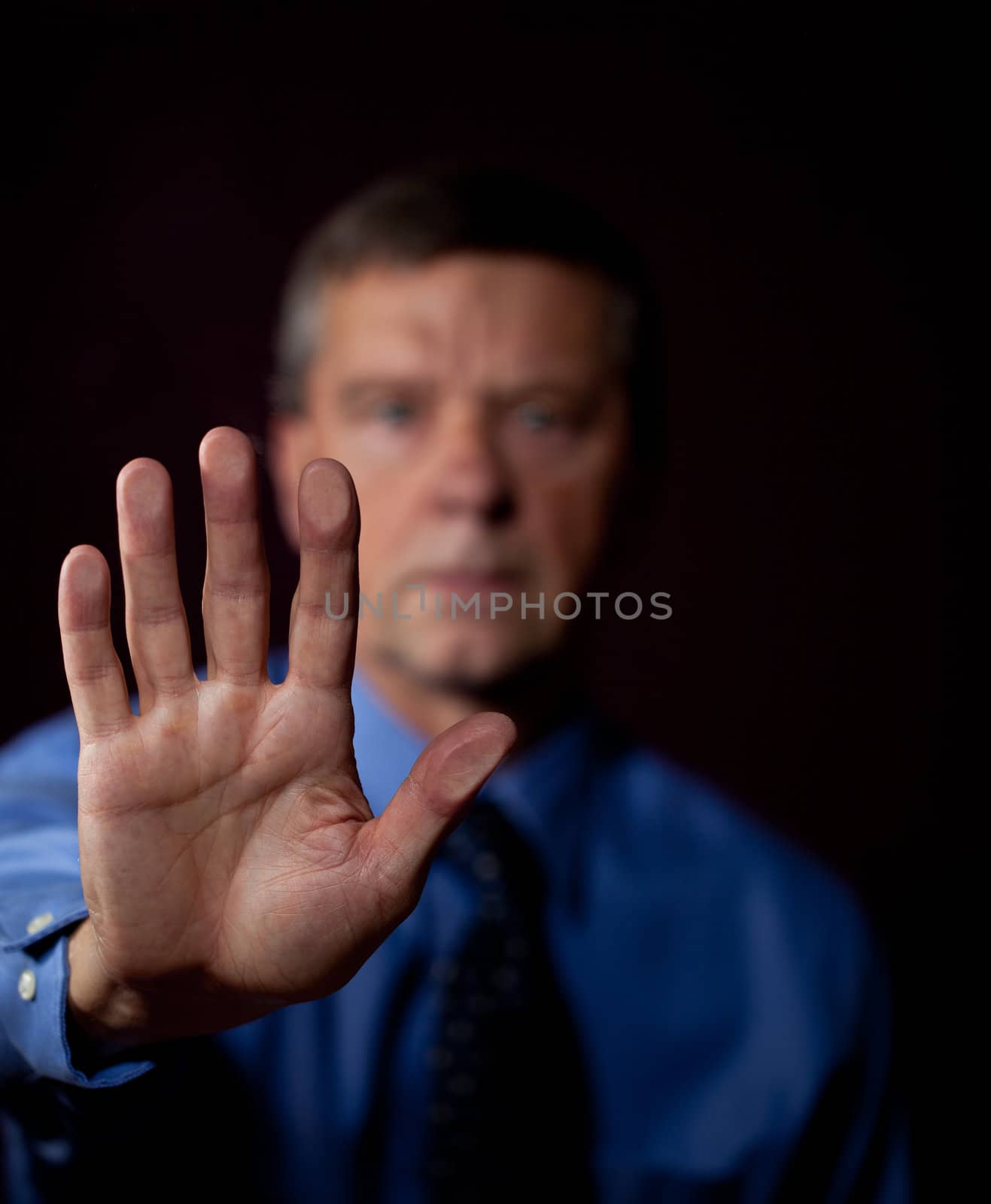 Senior executive or security man opens sensor by pressing hand onto the plate