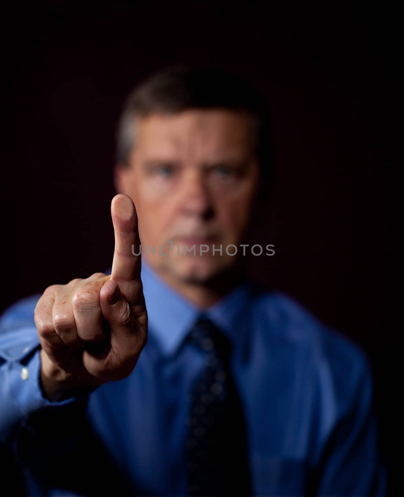 Senior executive or security man opens sensor by pressing finger onto the plate