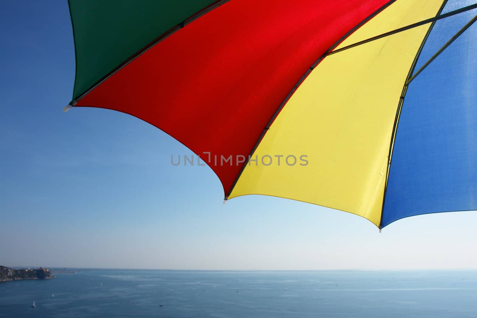 colorful parasol at the ocean on a sunny day