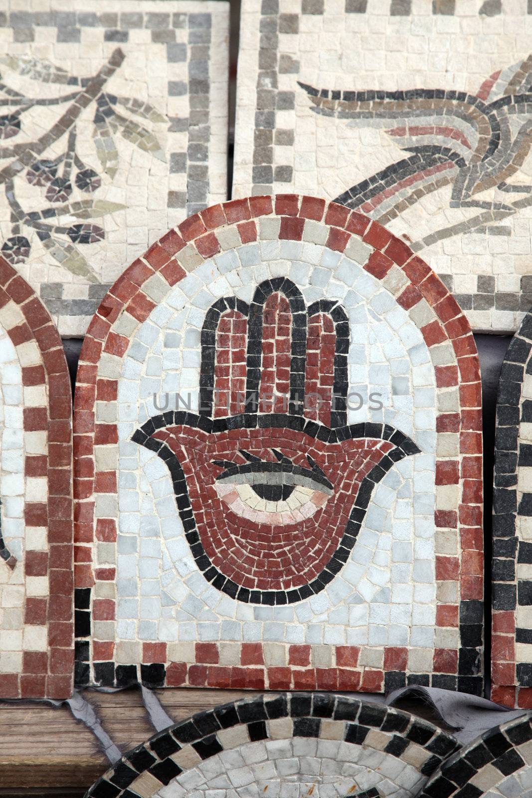 Fatima hand on the ceramic tile