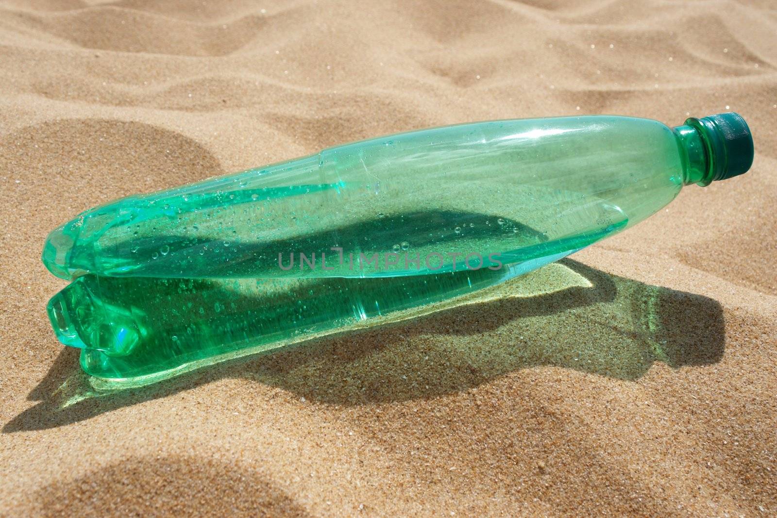 water bottle at the beach on a hot day