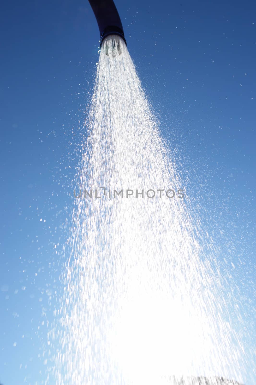 water drops falling from a shower outside