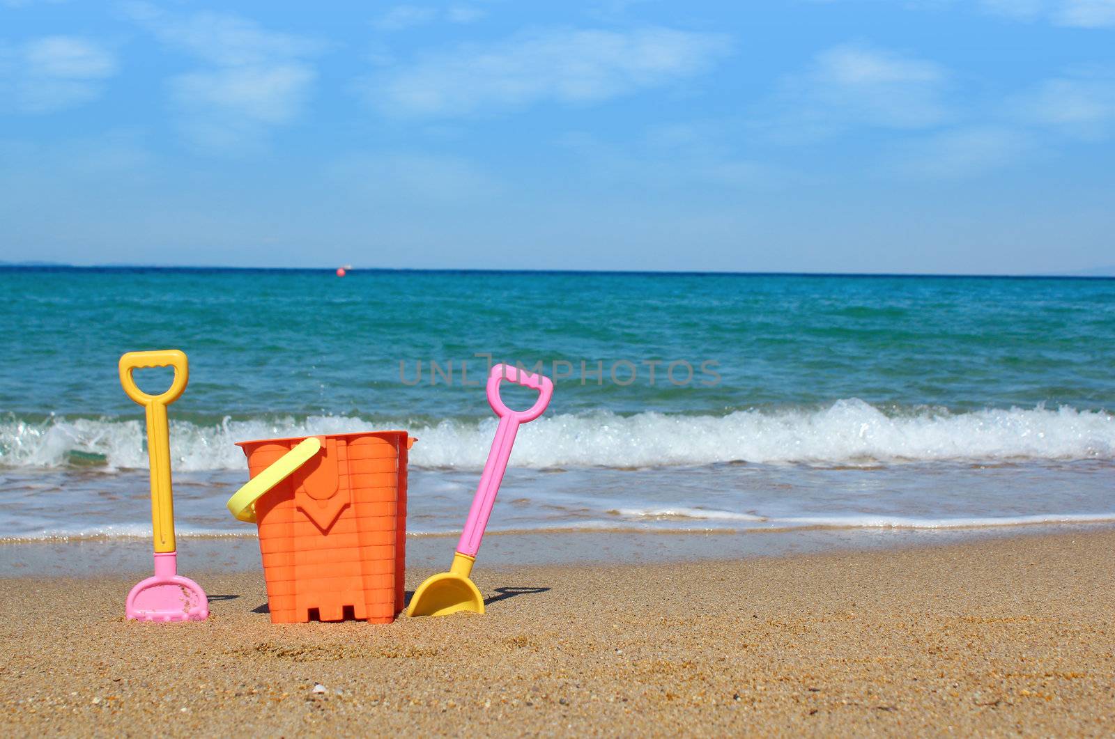 beach with toys summer scene by goce