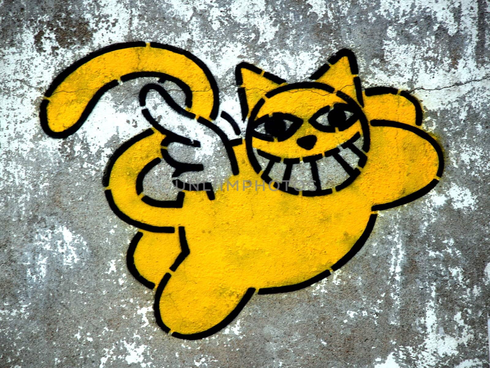 smiling cat paint on street wall