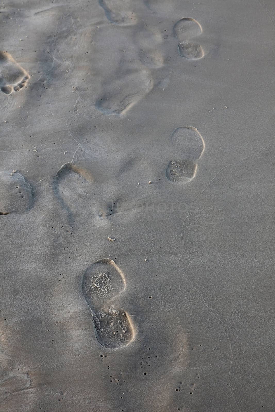 Human trace of a foot on sand by atlas
