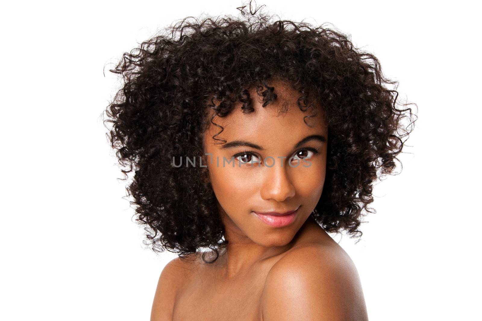 Beautiful happy female face with smooth skin and dark curly hair, isolated.