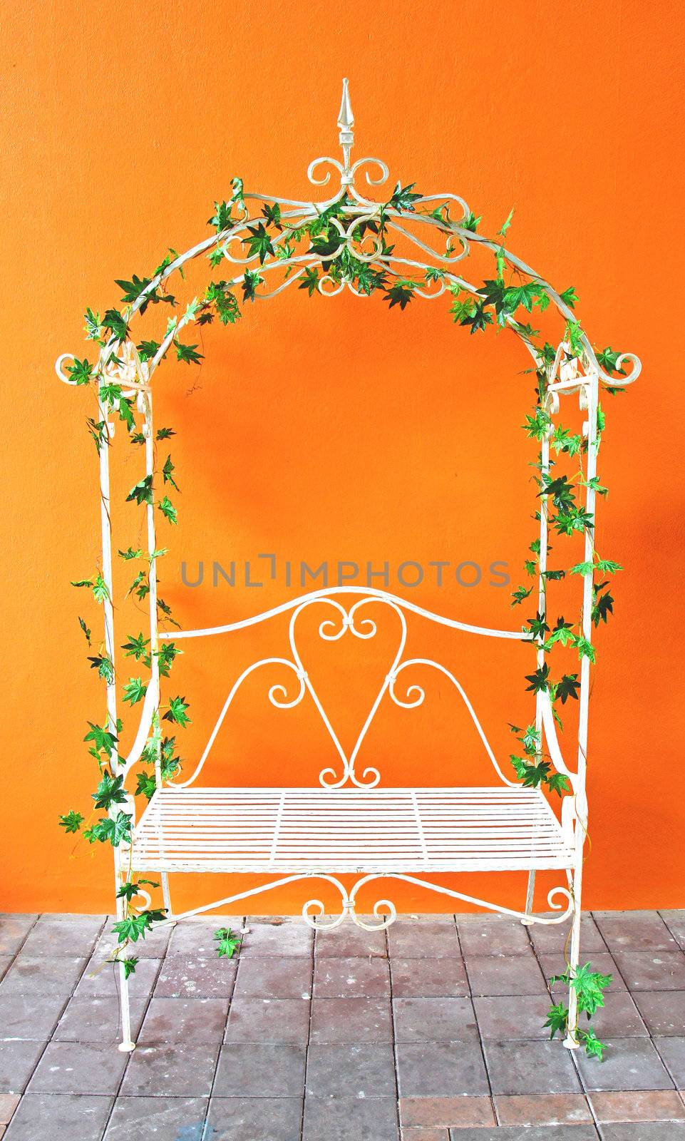 white romantic vintage chair with orange wall by nuchylee