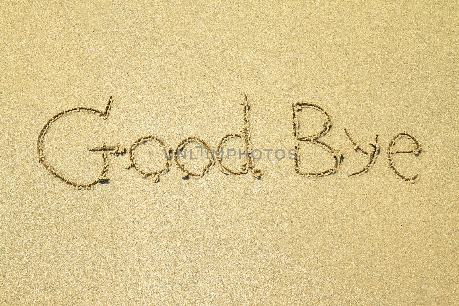 Good bye written on the sand at the beach