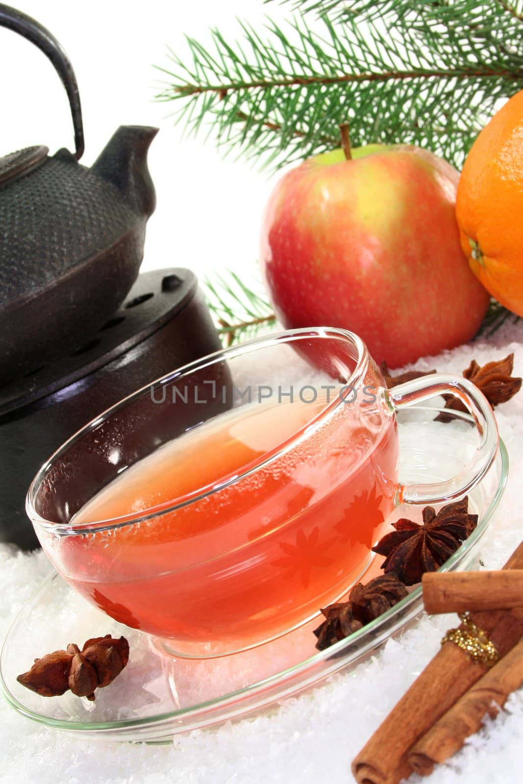 a cup of winter tea with fruit and spices