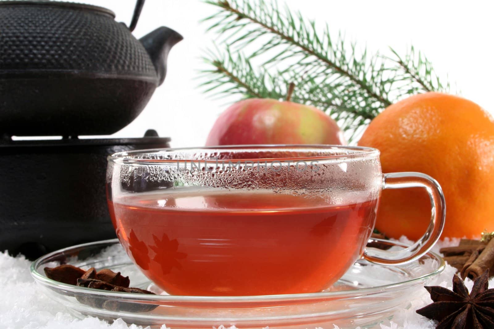 a cup of winter tea with fruit and spices