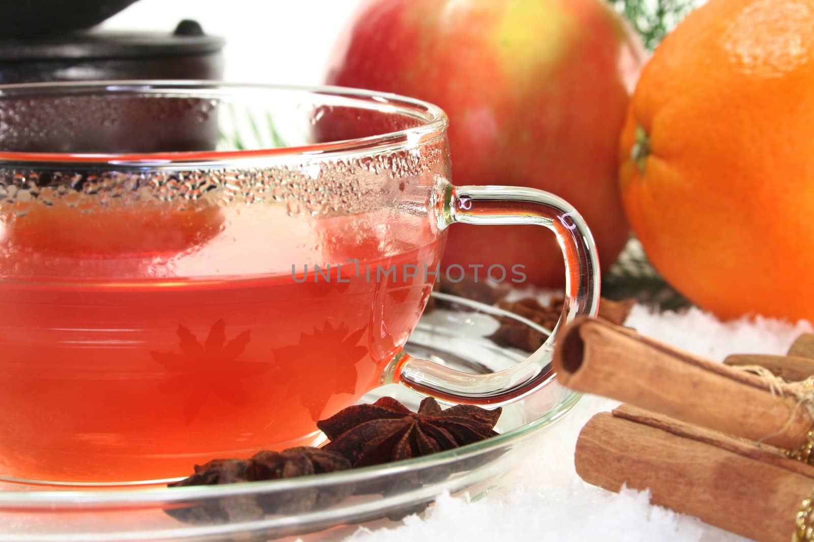 a cup of winter tea with fruit and spices