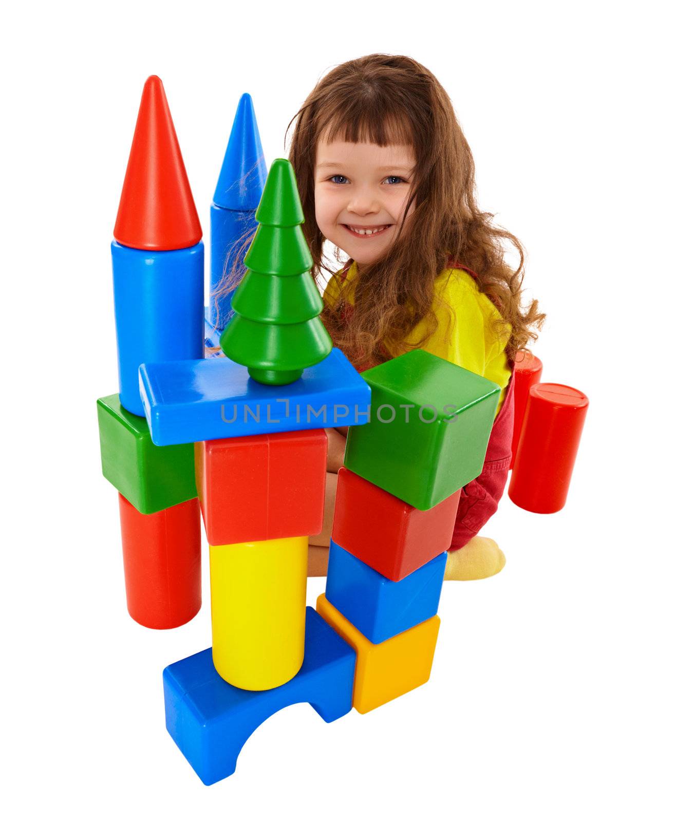 Small child built a castle from color cubes isolated on white background