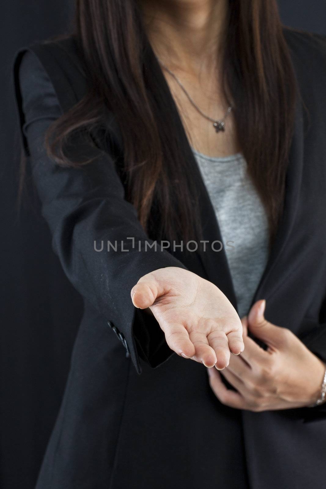 Business woman gives a handshake