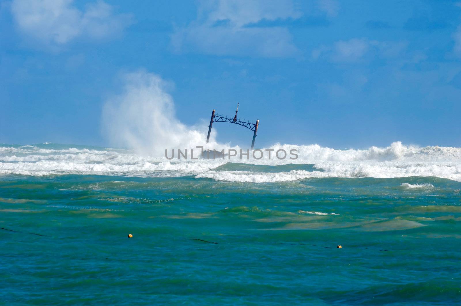 Sunken ship wreck and stormy sea with big waves