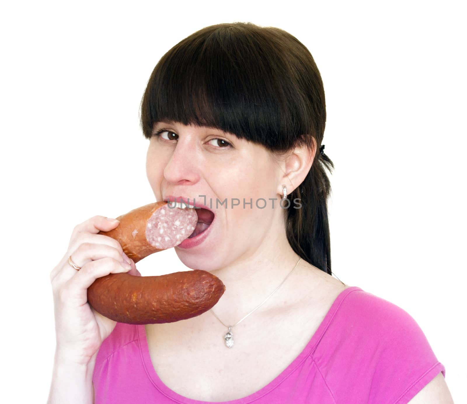 The young woman greedy eat a sausage