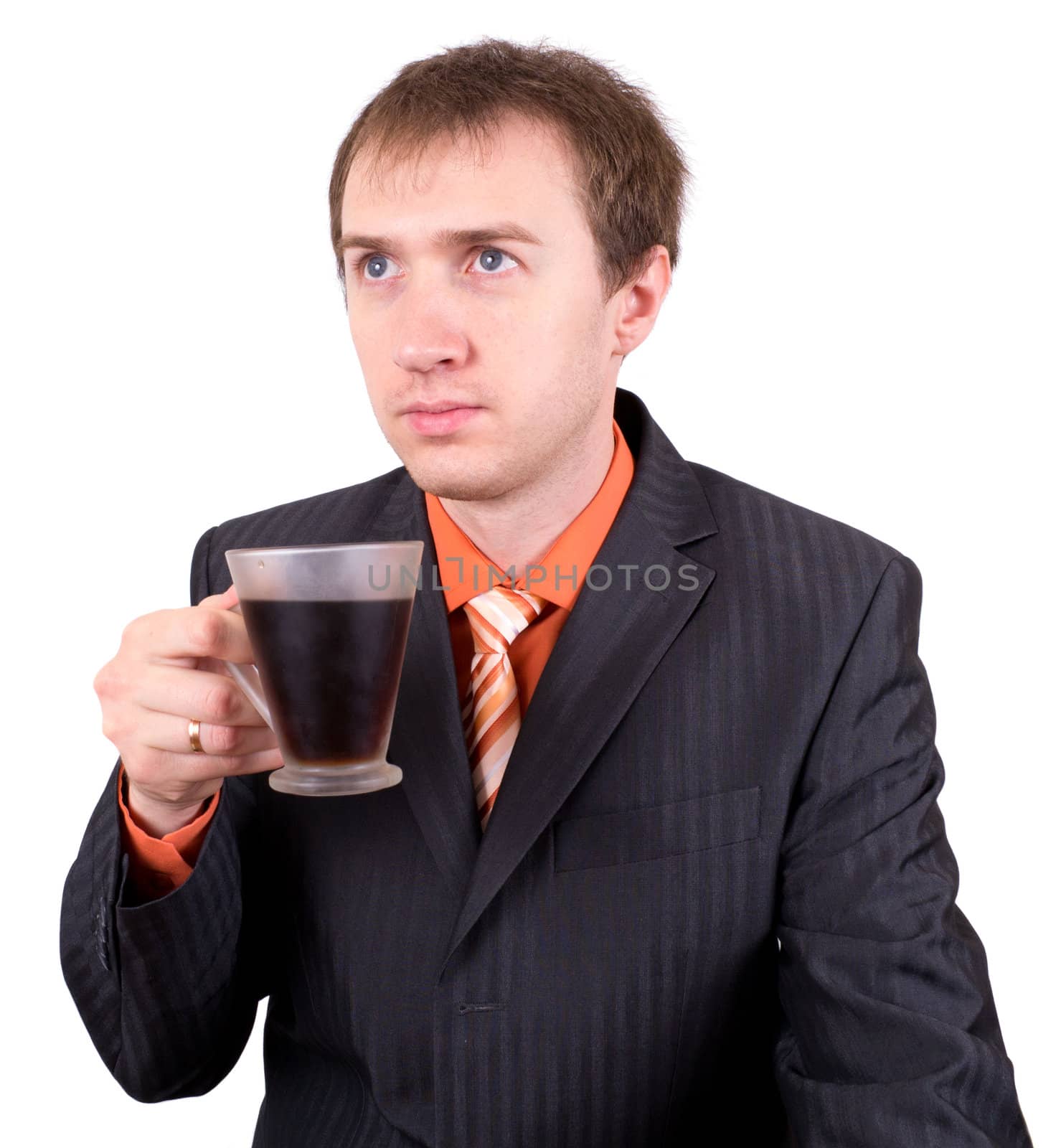 The young businessman drinks coffee