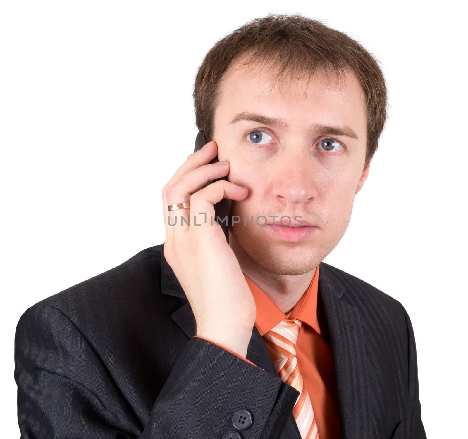 The businessman speaks by a mobile phone